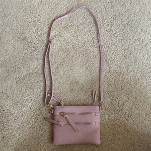 Lilac purse with 2 attachments, over the shoulder and wristlet.